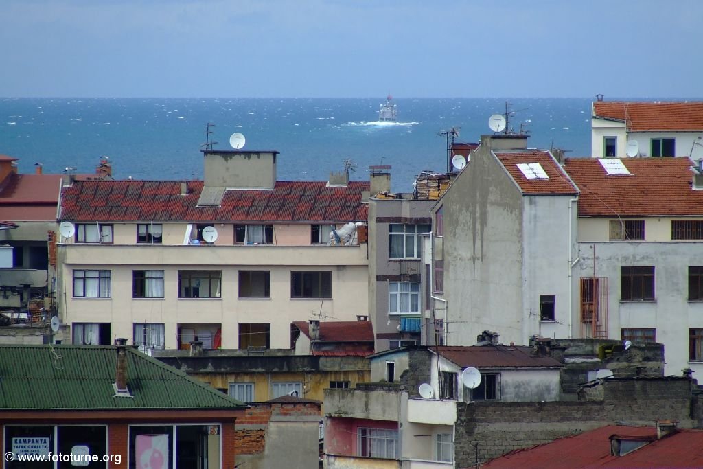 Вид из города на море